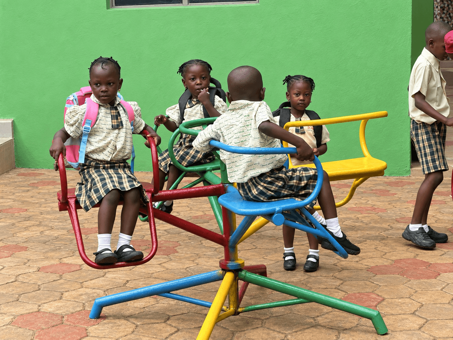 Tremad pupils on the playground roundabout
